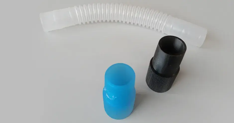 An original connector (translucent) and the 3D printed connector (black).