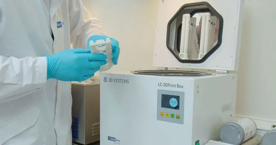 a person working at a 3D printer