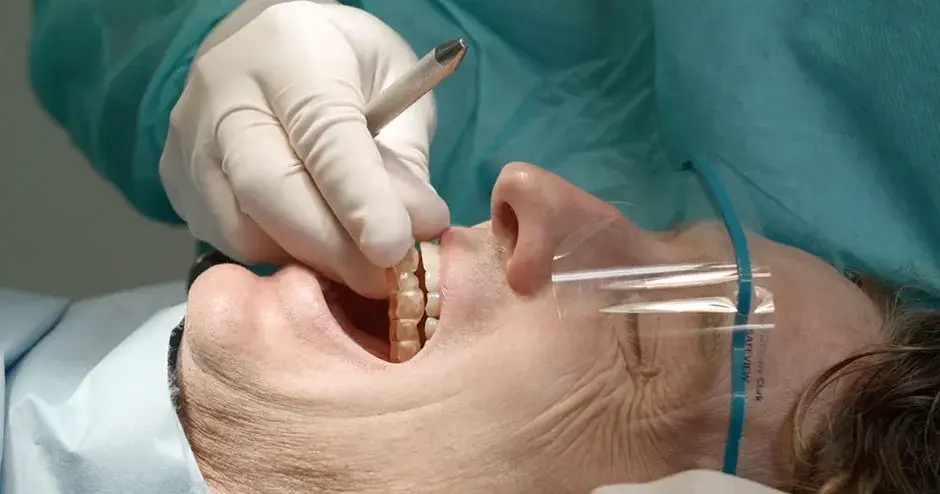 a person getting fitted for 3D printed dental implants