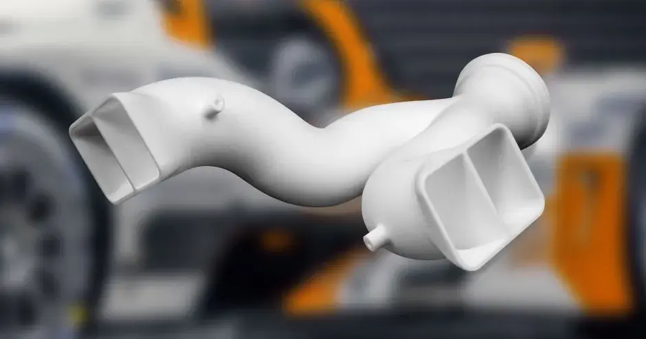 3D Printed White SLS Manifold Part with background