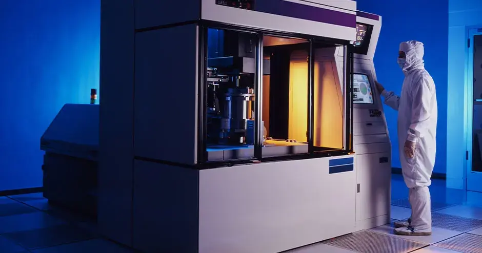 a person standing next to a 3D printer