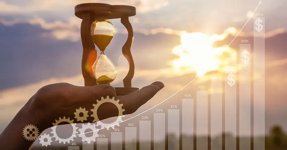 a hand holding an hourglass 