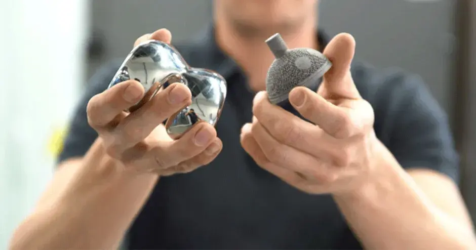 3D Systems Healthcare person holding hip cup and knee