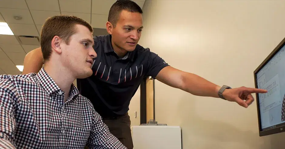 2 men working on software and collaborating