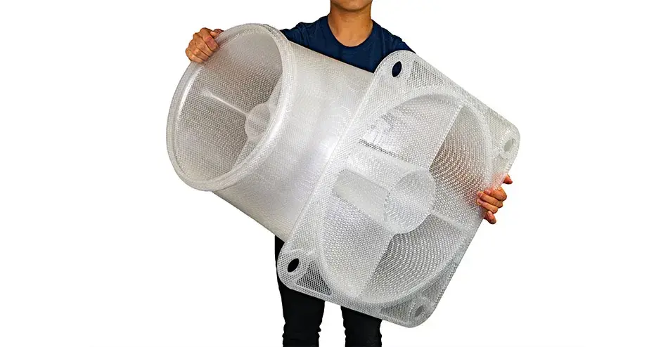 A man holding a 3D printed duct