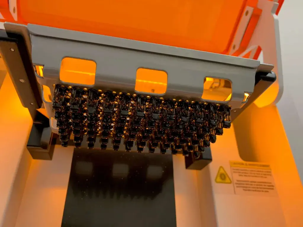 Build plate of Figure 4 Standalone 3D printer at WS Audiology full of parts
