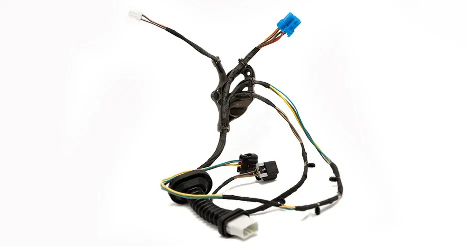 Wiring harness designed to route cables in vehicles and trains while fitting into the limited space and packaging requirements under the hood and behind the dashboard.​