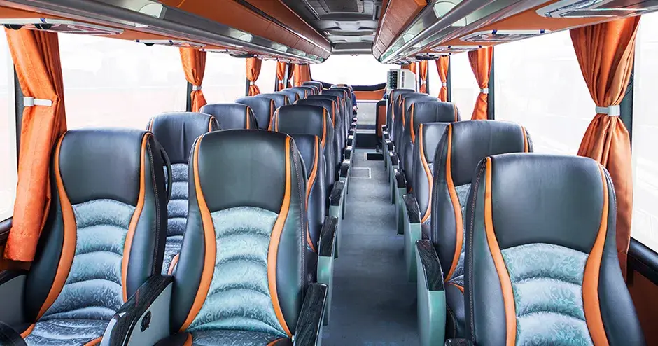 Interior view of a tour bus with cohesive design features for enhanced customer experience