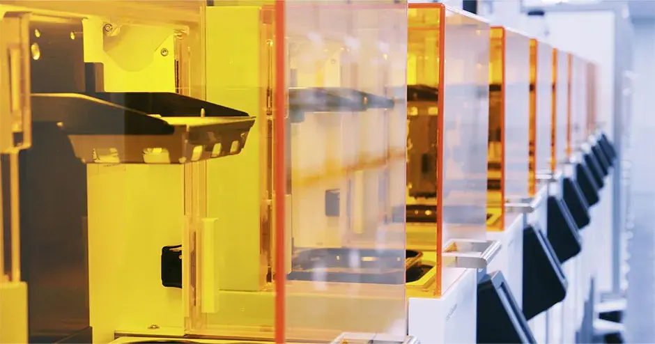 a row of Figure 4 3D printers