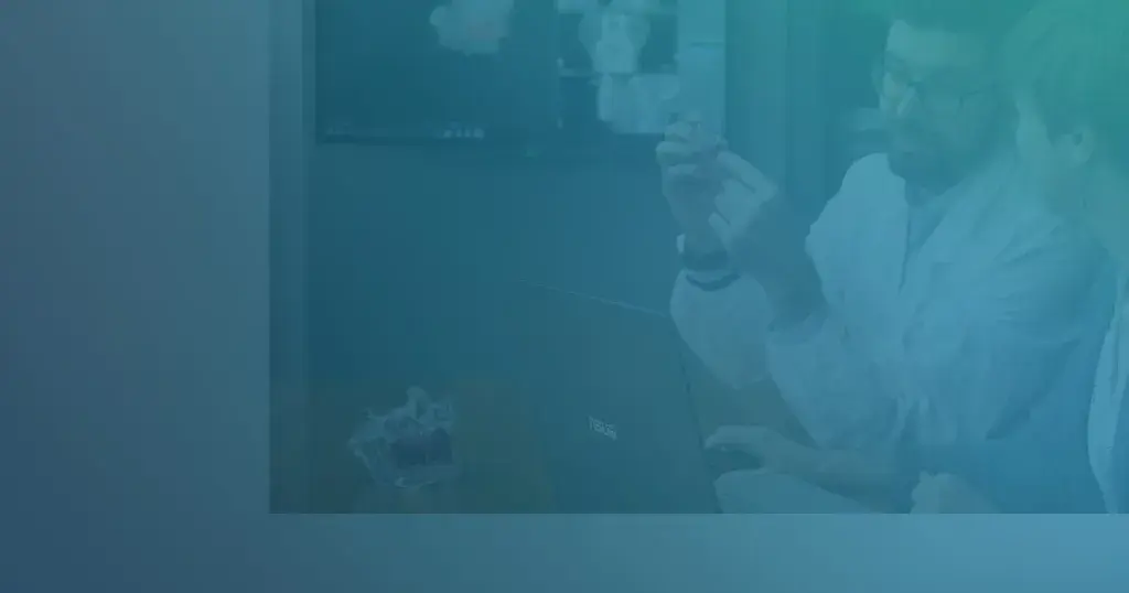 Two surgeons with anatomic model