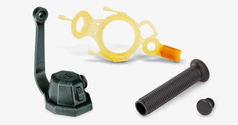 Part collage of different 3D printed parts produced using elastomer and rubber-like materials as well as a 3D printed eggshell mold for a silicone injection gasket.