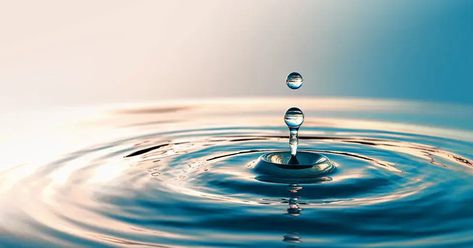 A drop of fresh clean water in a larger body of water