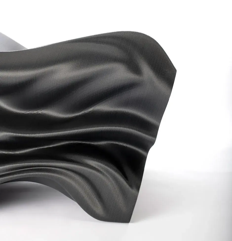 Side view of the 3D printed Steam Lounge Chair designed by Slicelab and 3D printed in carbon fiber ABS pellets on EXT 1270 Titan Pellet 3D printer. 