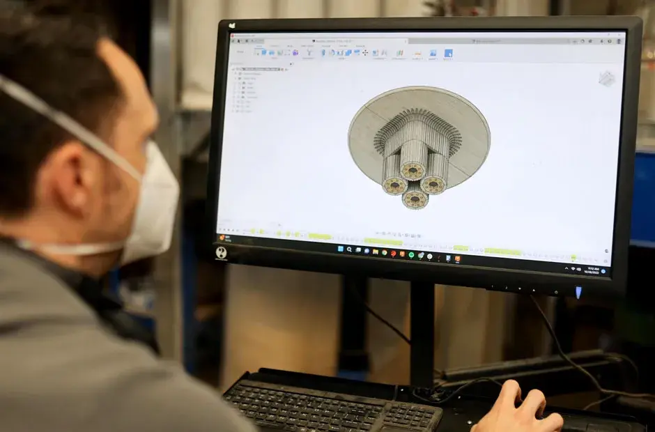 A person working on a CAD file designing a chair