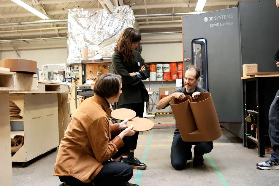 Designers discuss Gather Stool components printed on the EXT 1070 Titan Pellet printer.