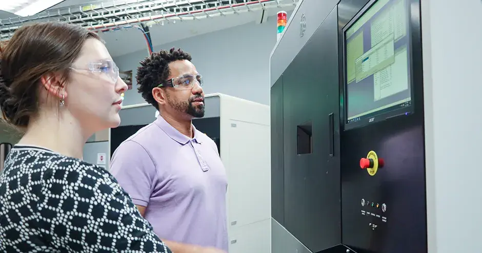 3D Systems employees at a printer