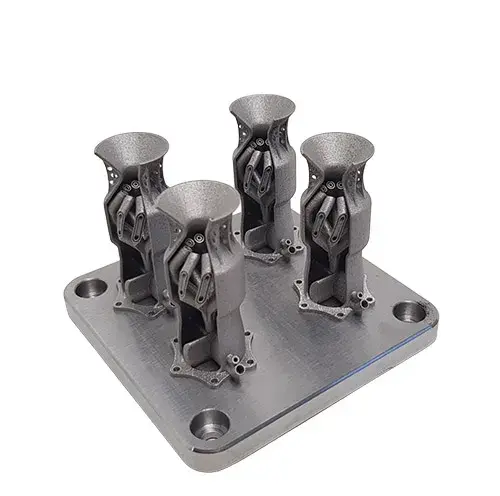 4 fuel nozzles on build plate 3D printed in LaserForm 17 materials