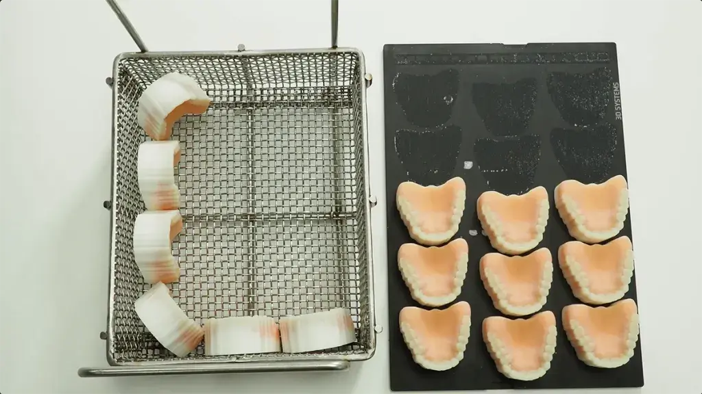 NextDent 300 3D printed dentures are put into an air-forced oven to melt away wax supports.