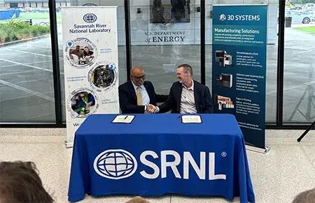 Dr Martin Johnson and Dr Johney Green sign the CRADA at SRNL