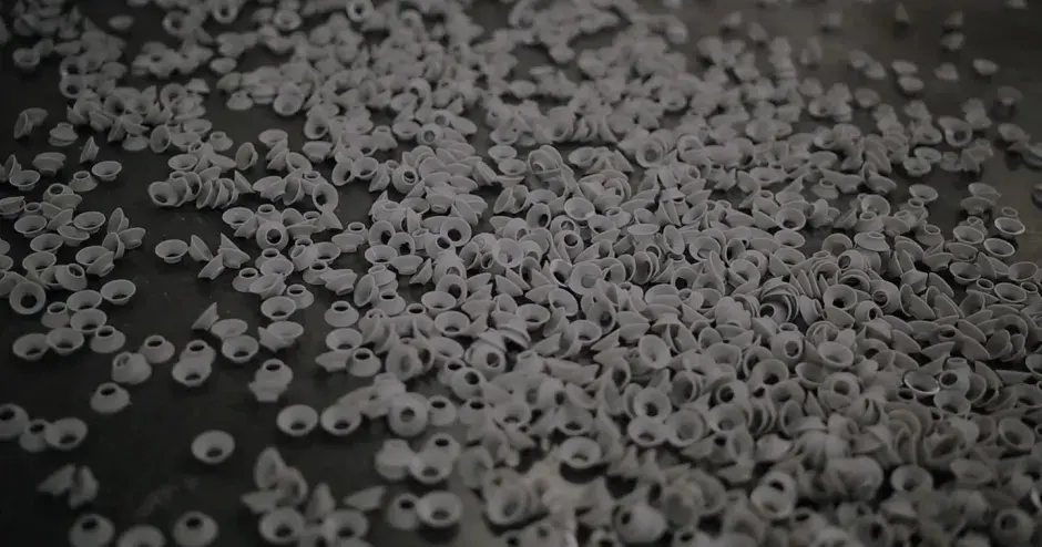 A plethora of small 3D printed parts representing manufacturing