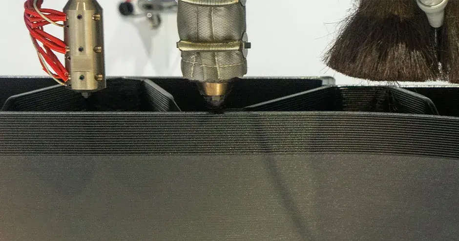An EXT Titan 1270 3D Printer showing printer heads and a spindle